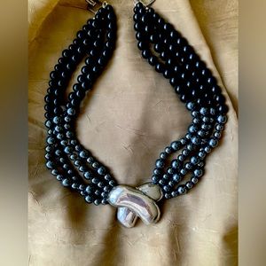 Checker with hematite and black beads.
